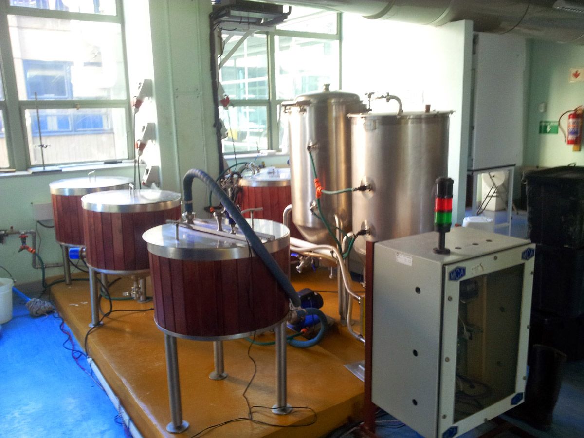 Fermentation and sensors are set up inside a room with windows on the left wall.