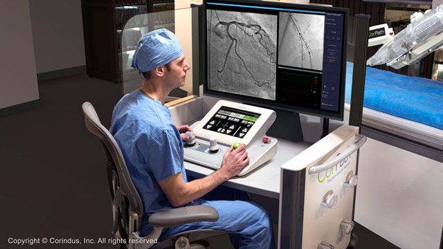 Physician driving CorPath GRX from the interventional cockpit. Image Credit: Corindus