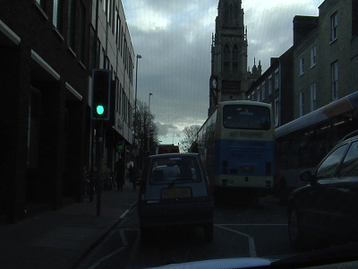 RGB image of a street scene with vehicles and pedestrians